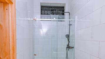 Shower, hair dryer, towels, soap