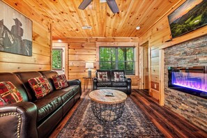 TV, fireplace - *Stunning 4BD Near TOWN! Theater Room + HOT TUB! (Pigeon Forge)