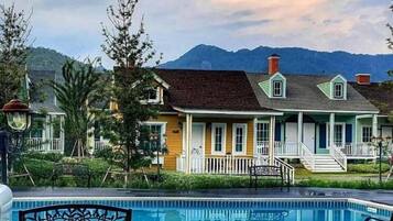 Deluxe Room, Pool View | In-room safe, individually decorated, individually furnished