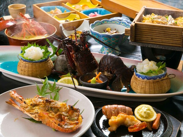 A variety of seafood dishes including lobster, shrimp, and crab, served on a table with traditional Japanese bowls and plates. - Exquisite spiny lobster Half Board plan Nonsmoking Japanesestyle room with 12 tatami mats / Minamikyushu Kagoshima (Minamikyushu)