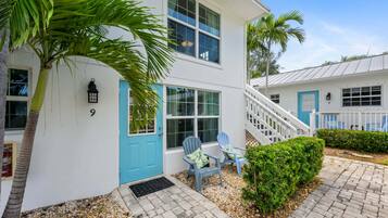 Stunning two-story home with a spacious porch and beautifully maintained garden.