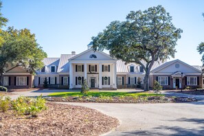 A large, two-story building with a symmetrical facade, central entrance with columns, and a prominent dome. - Golf and Beach Resort, 2BR, Pool (Pawleys Island)