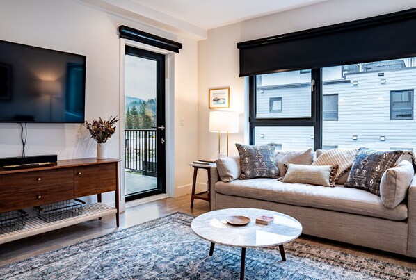 Condo | Living area | 40-inch flat-screen TV with cable channels - Powder Pines Retreat Revelstoke Vacation (Revelstoke)