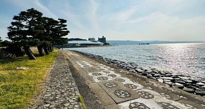 A panoramic view of Lake ShinjiSpacious living s / Matsue Shimane