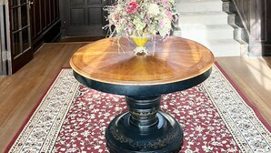A grand staircase with a chandelier, a round wooden table with a floral centerpiece, and a patterned carpet. - Spectacular Historic Mansion w/Pool&Tennis (Goshen)