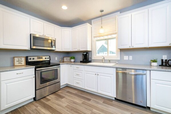 Fridge, microwave, oven, cookware/dishes/utensils