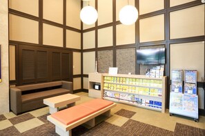 Relax in comfort with a sofa, benches, and a convenient table in this welcoming space.