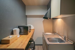 Fridge, microwave, cookware/dishes/utensils