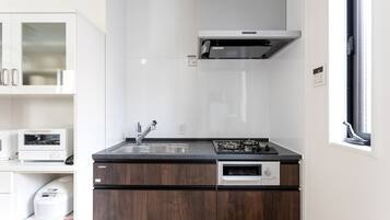 Fridge, microwave, stovetop, cookware/dishes/utensils