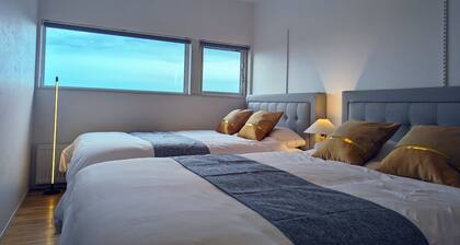 Villa with glass atrium living room / Yubari-gun Hokkaidō