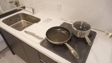 Fridge, microwave, stovetop, cookware/dishes/utensils