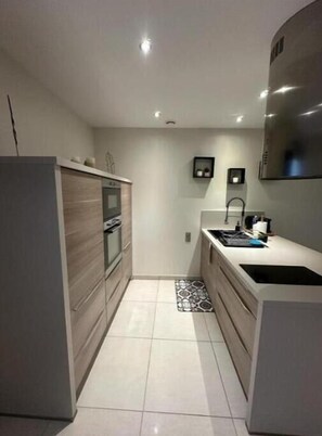 Fridge, microwave, oven, cookware/dishes/utensils