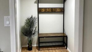 A room with a bunk bed, a potted plant, and wooden flooring. - Comfy and modern private suite - everything you need for a short to midterm stay (Dryden)