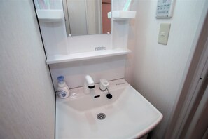 Hair dryer, towels, soap, shampoo