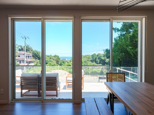 House surrounded by trees with a dog run / Kamogun Shizuoka