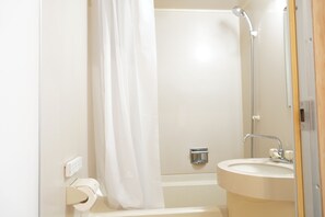 Combined shower/tub, free toiletries, hair dryer, slippers