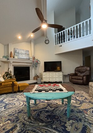 Living area - The Bluebird.  Cozy cottage on the lake, tucked away from the main channel. (Village of Four Seasons)