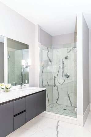 Shower, hair dryer, towels, shampoo