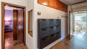 A modern interior with a wooden wardrobe, a black padded cabinet, and a dining area with a view. - Awesome home in Borso del Grappa with house a panoramic view (Borso del Grappa)