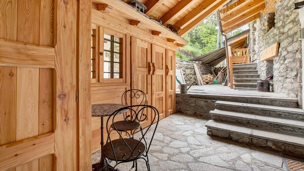 A wooden cabin interior with a stone staircase leading outside. - Studio 'Aux Pieds Du Malatra' 1 with Mountain View (Saint Rhemy en Bosses)