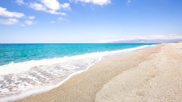 A beach with a pebbly shore and calm turquoise waters. - Awesome home in Caronia (Caronia)