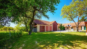 A rural property with a barn, a small house, and a fenced yard. - Awesome home in Ivanska (Ivanska)