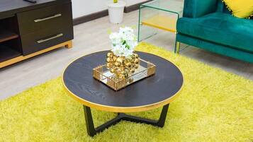 Deluxe Apartment | Living area | 40-inch LED TV with satellite channels