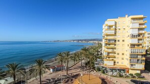 A coastal hotel with multiple floors, balconies, and a beach view. - Nice apartment in Algarrobo-Costa (Algarrobo-Costa)