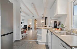 Fridge, stovetop, dishwasher, coffee/tea maker