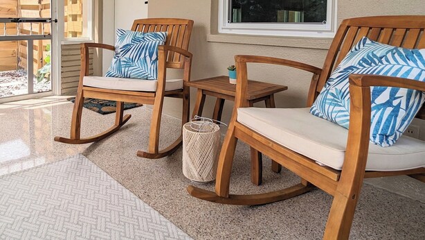 A covered porch with two rocking chairs, a small table, and a large window. - Downtown Villa-Fully equipped! Short drive Beaches, Short Walk to Payne Park.  (Sarasota)