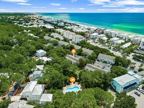 An aerial view of a coastal residential area with houses, a swimming pool, and a beach. - Seagrove- 3 Min walk to Beach, 2 BR, Pool, Tennis & sleeps 6 (Santa Rosa Beach)