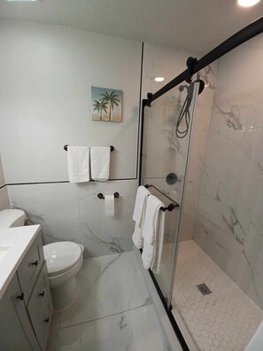 Shower, hair dryer, towels, soap