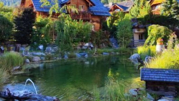 A wooden cabin with a pond in front, surrounded by greenery and hills. - st martin chalets by Interhome (Sankt Michael im Lungau)