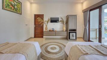 A modern bedroom with two beds, a TV, a cabinet, and a view of the outdoors.