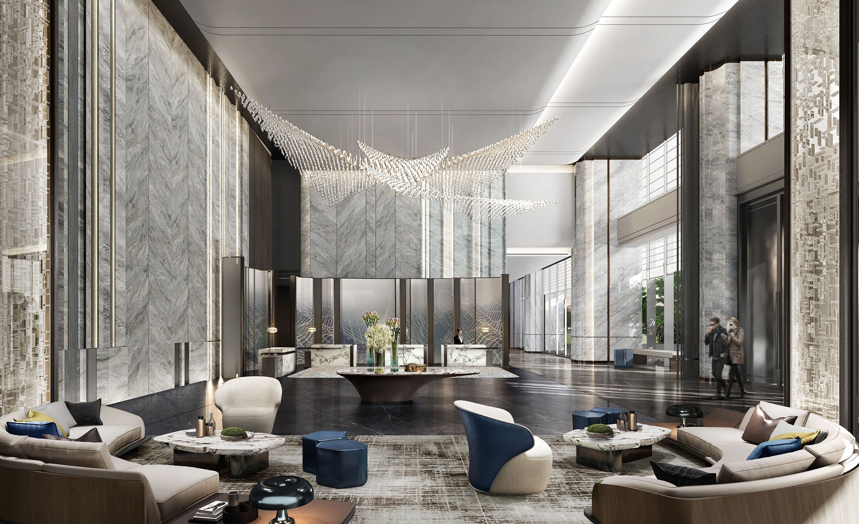 A modern lobby with marble walls, a central reception desk, and seating areas.