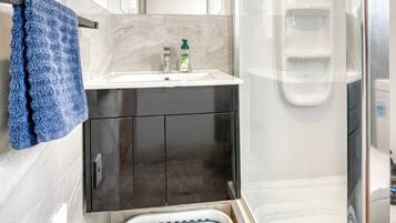 Shower, hair dryer, towels, soap