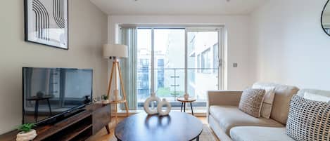 Apartment | Living area | 37-inch TV with cable channels, Netflix, streaming services