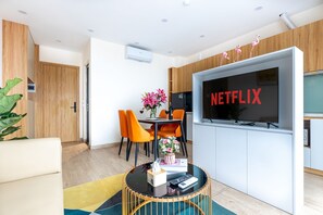 Premium Apartment | Living area | 43-inch LCD TV with digital channels, Netflix, streaming services - Yen Boutique Apartments (Hanoi)