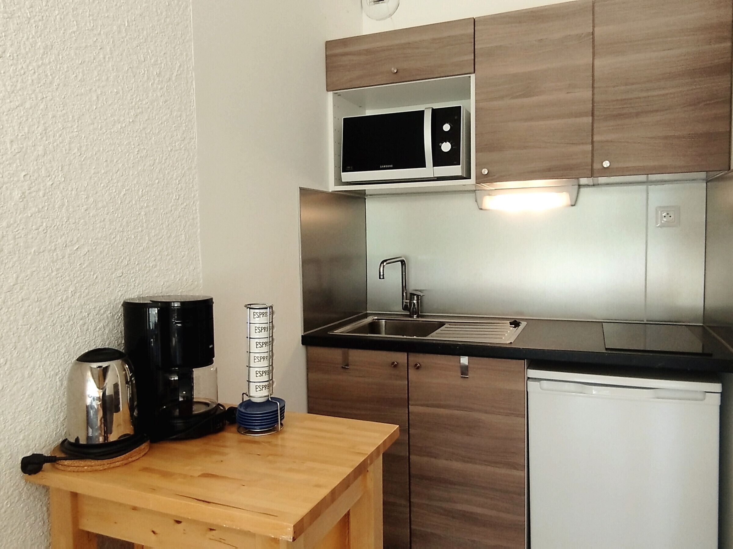 Fridge, microwave, stovetop, coffee/tea maker