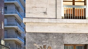 A building facade with the inscription "GALLERIA ITALIA NAPOLI" on a stone wall. - Residenza Toledo Lifestyle (Naples)