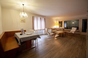 Comfort Apartment | Living area | 40-cm flat-screen TV with cable channels