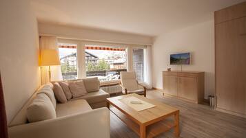 Comfort Apartment | Living area | 40-cm flat-screen TV with cable channels