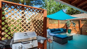 A patio with a grill, outdoor seating, and a telescope. - 1 Mi to Trails: Pet-friendly Home in West Sedona! (Sedona)