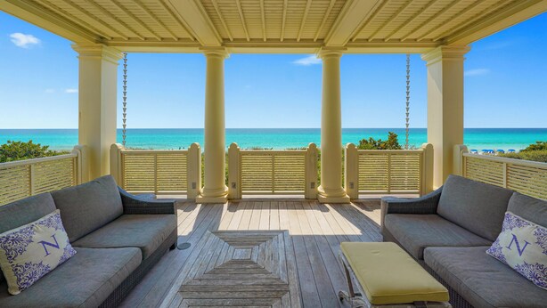 A covered outdoor seating area with a view of the ocean. - Beachfront Luxury in Seaside, Sleeps 24! Wow Porches & Gulf Views + 2 Bikes! (Santa Rosa Beach Fl)