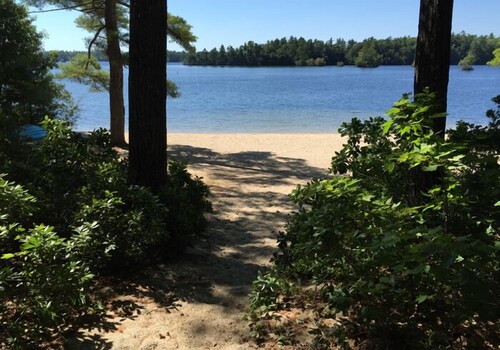 Charming Lakefront Cottage with Screened Porch & Shared Beach Access