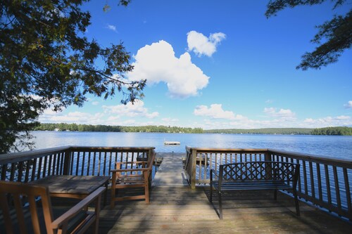 Family compound on Thomas Pond featuring main house and two small cottages.