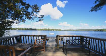 Family compound on Thomas Pond featuring main house and two small cottages.