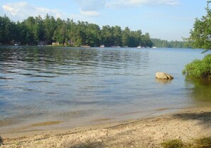 On the beach - Cozy camp with large sandy beach and excellent views of Little Sebago. (Raymond)