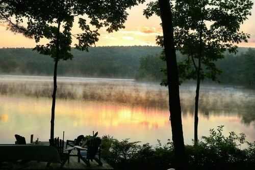 Pet-friendly home on peaceful Raymond Pond with beautiful sunrise views!