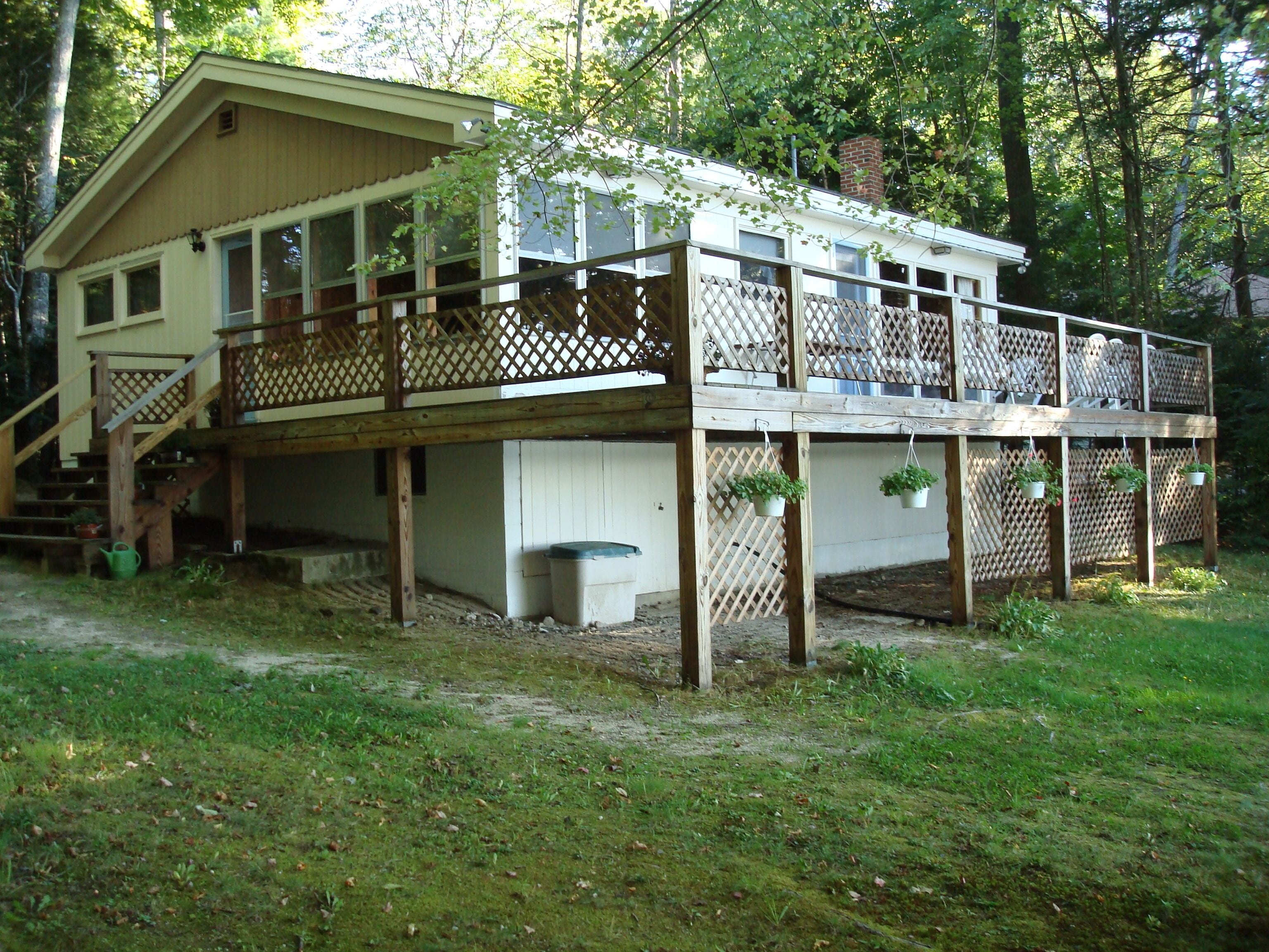 Cozy cottage in serene setting with a lovely sandy entry to Brandy Pond!